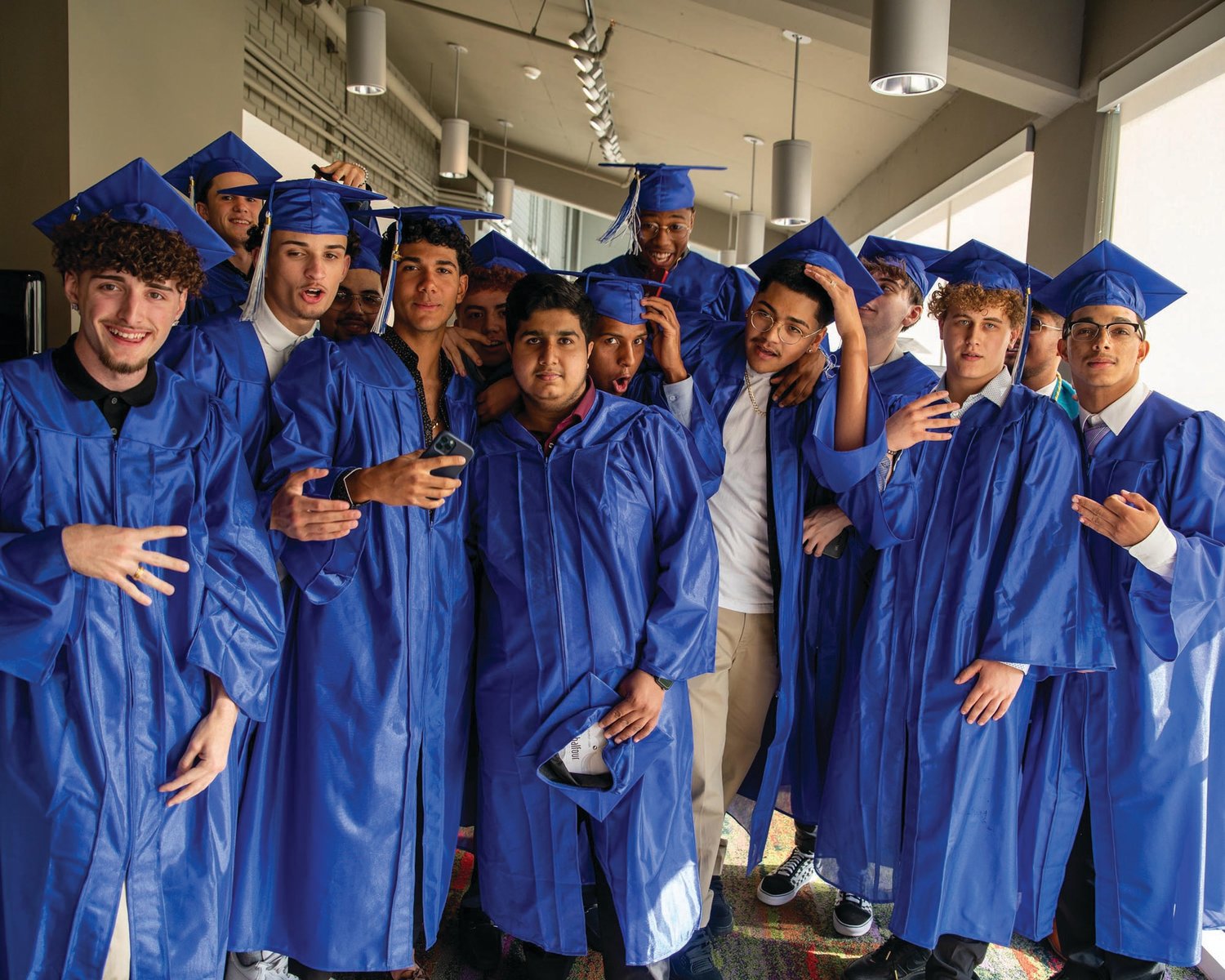 ANXIOUS GRADS: Above and below, the Johnston Senior High School Class of 2022 lined up in a hallway behind the scenes of the ceremony held Friday at Veterans Memorial Auditorium in Providence. (Photos by Leo van Dijk/rhodyphoto.zenfolio.com)